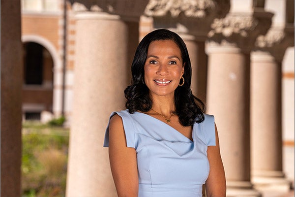Photo of Paula Gilmer DesRoches wearing a blue dress (close-up)
