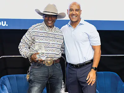 President DesRoches presents Johnnie Thomas with a 40-year milestone award